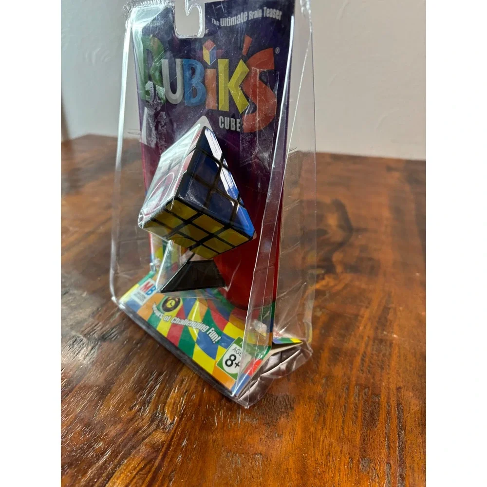 Milton Bradley Rubiks Cube 3x3 Puzzle with Stand and Booklet 54033 New Sealed